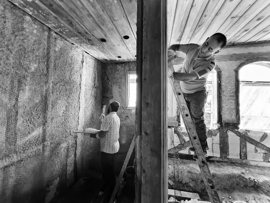 Technician using tools during a service visit